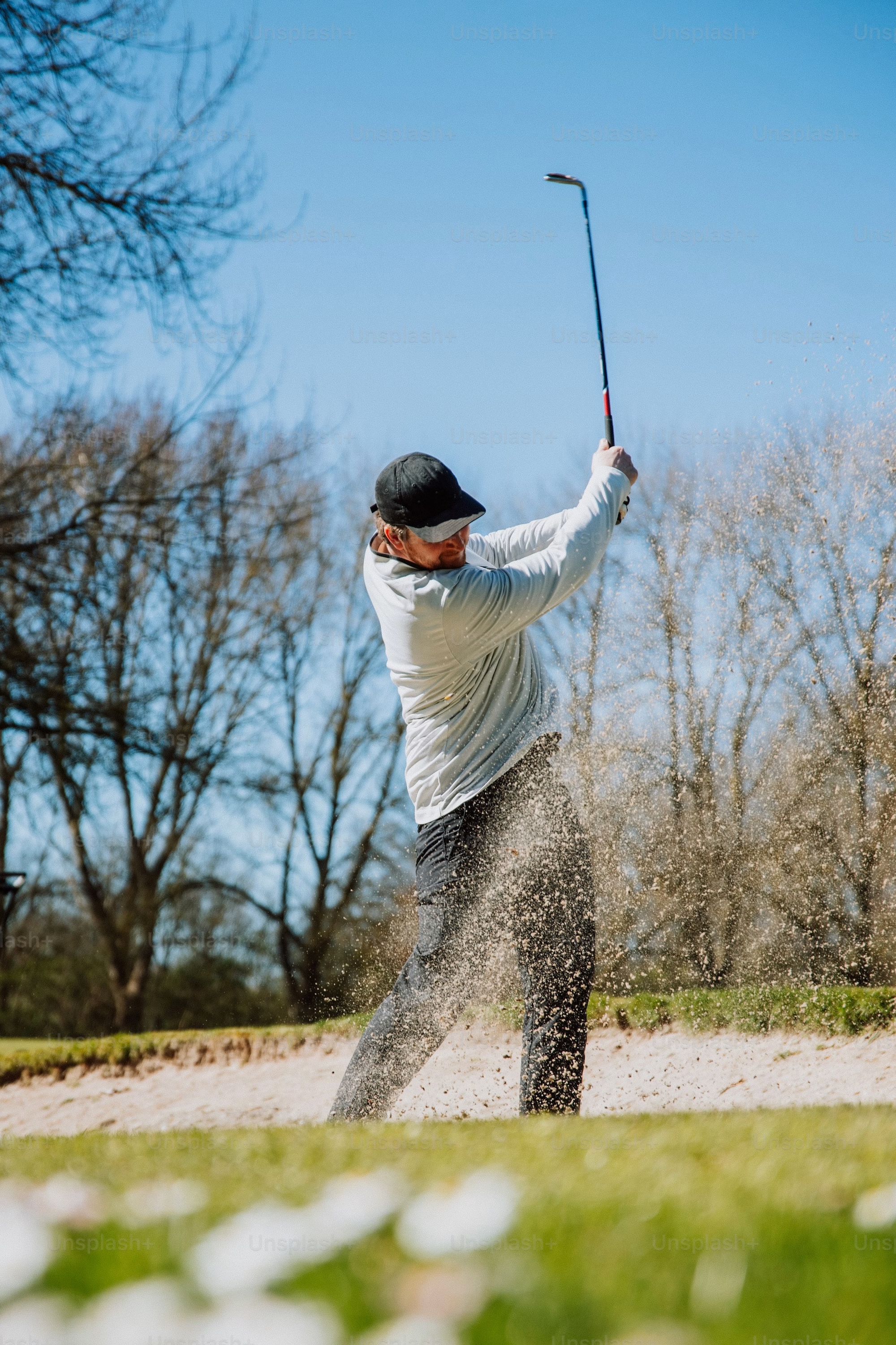Golfer on a green managed with TurfEnhancer.